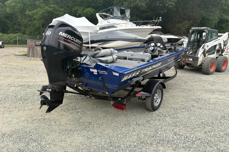 Slide: The Image of 2015 Tracker Pro Team 175 TF boat with Mercury engine on gravel lot. - 4