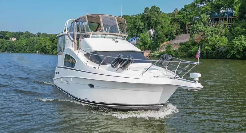 Slide: The Image of 2007 Silverton 35 Motor Yacht cruising on a scenic river. - 2