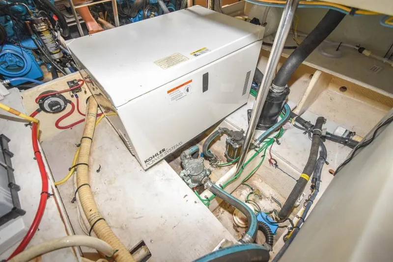 Slide: The Image of Engine room of 2007 Silverton 35 Motor Yacht with generator and wiring. - 23