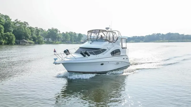 Slide: The Image of 2007 Silverton 35 Motor Yacht cruising on a serene lake. - 6