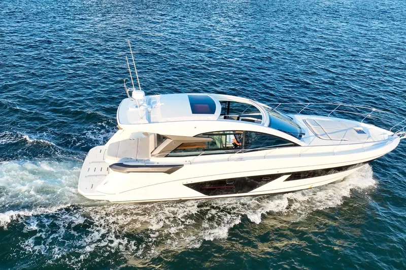 Slide: The Image of 2023 Beneteau Gran Turismo 45 yacht cruising on open water. - 10