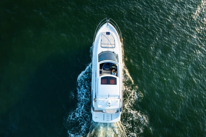 Slide: The Image of Aerial view of 2023 Beneteau Gran Turismo 45 yacht cruising on open water. - 12