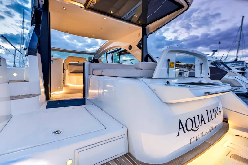 Slide: The Image of 2023 Beneteau Gran Turismo 45 yacht, luxurious deck view at sunset, named Aqua Luna. - 15
