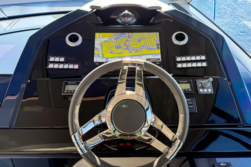 Slide: The Image of Helm of 2023 Beneteau Gran Turismo 45 with navigation display and controls. - 20