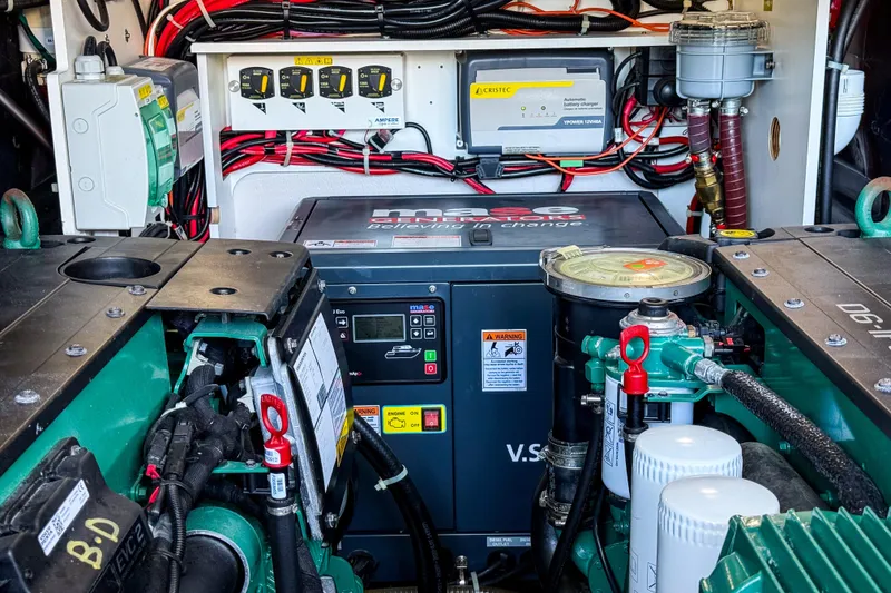 Slide: The Image of Engine room of 2023 Beneteau Gran Turismo 45 with advanced machinery and wiring. - 25