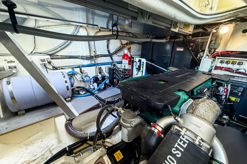 Slide: The Image of Engine room of 2023 Beneteau Gran Turismo 45 yacht, showcasing advanced machinery and equipment. - 26