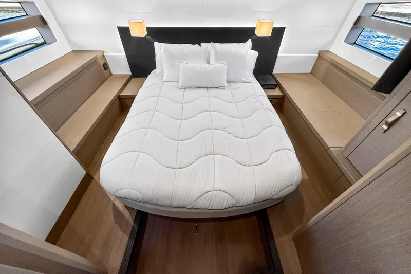 Slide: The Image of Luxurious cabin interior of 2023 Beneteau Gran Turismo 45 yacht with cozy bed. - 29