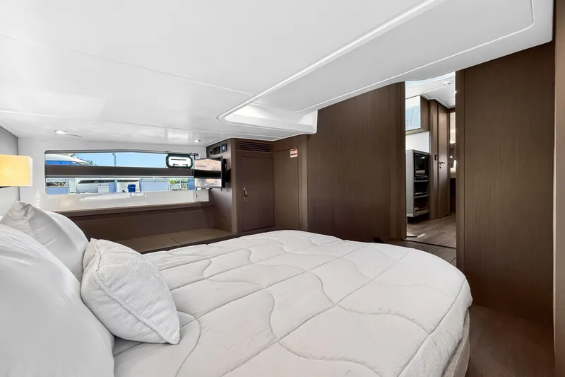 Slide: The Image of Luxurious cabin interior of 2023 Beneteau Gran Turismo 45 yacht, featuring a cozy bed and modern design. - 31