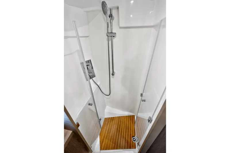 Slide: The Image of Modern shower in 2023 Beneteau Gran Turismo 45 yacht with wooden floor and glass door. - 34