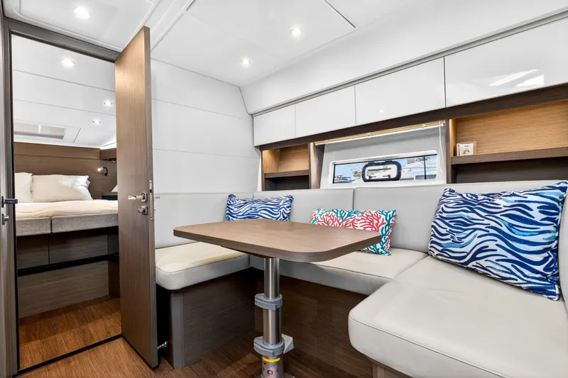 Slide: The Image of Interior of 2023 Beneteau Gran Turismo 45 yacht with cozy seating and vibrant cushions. - 37