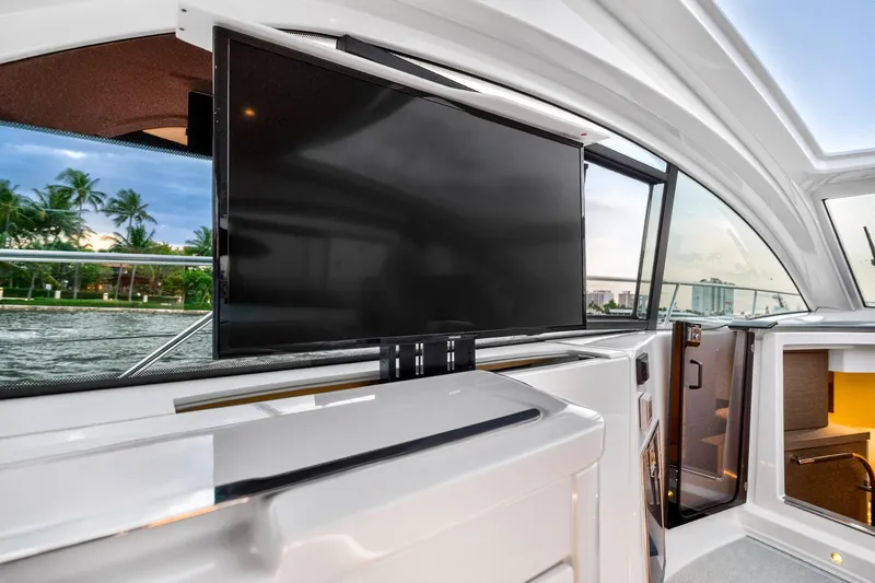 Slide: The Image of Interior of 2023 Beneteau Gran Turismo 45 yacht with modern TV and scenic window view. - 40
