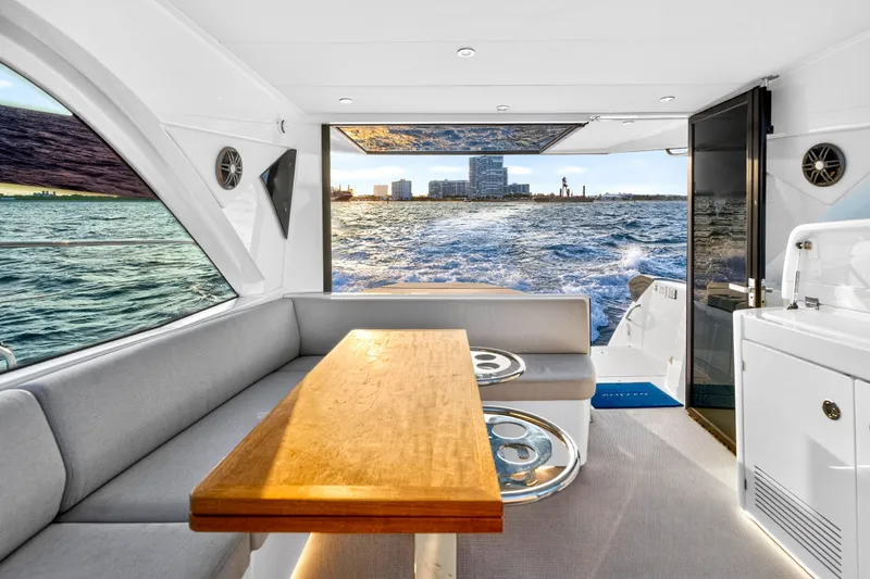 Slide: The Image of Interior of 2023 Beneteau Gran Turismo 45 yacht with ocean view and modern seating area. - 42