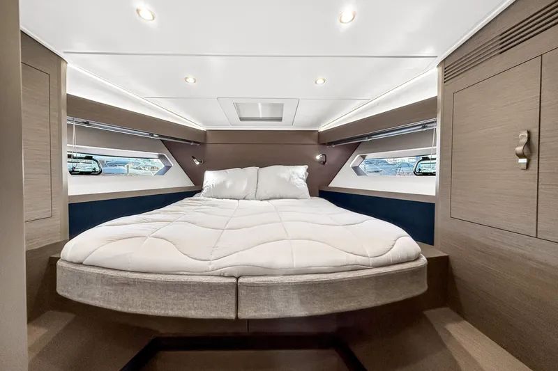 Slide: The Image of Luxurious cabin interior of 2023 Beneteau Gran Turismo 45 yacht with cozy bed. - 44