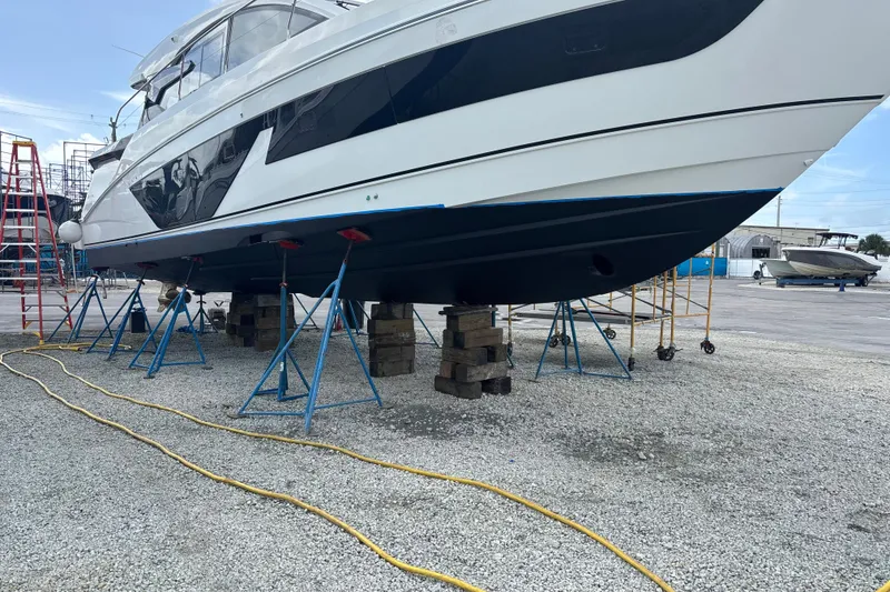Slide: The Image of 2023 Beneteau Gran Turismo 45 yacht on stands in a boatyard. - 52