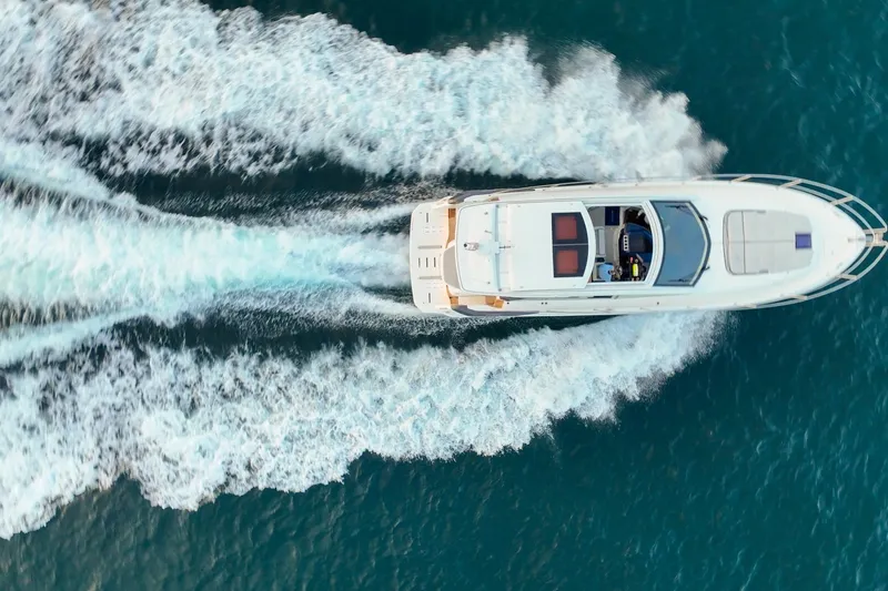 Slide: The Image of Aerial view of 2023 Beneteau Gran Turismo 45 yacht cruising on blue ocean waters. - 8