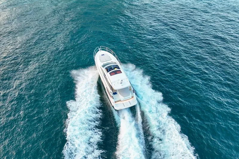 Slide: The Image of 2023 Beneteau Gran Turismo 45 yacht cruising on open blue waters. - 9
