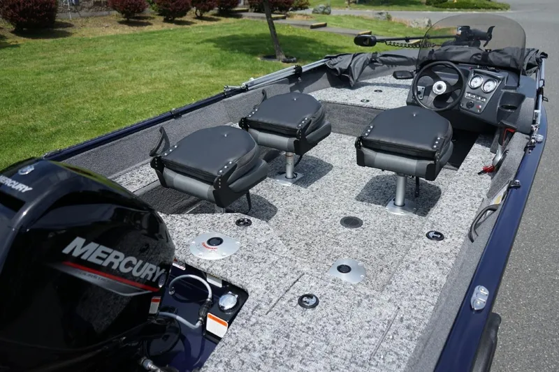 Slide: The Image of 2025 TRACKER BOATS Pro Guide V16 SC interior with Mercury engine and seating arrangement. - 5