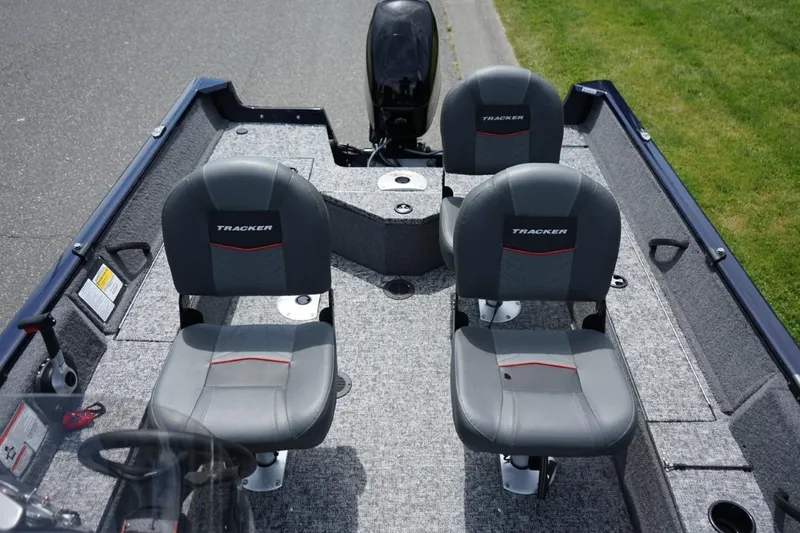 Slide: The Image of 2025 TRACKER BOATS Pro Guide V16 SC interior with three seats and steering wheel. - 6