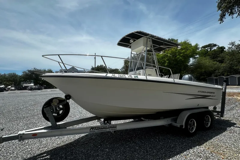 The Image of 2008 Hydra Sport 212 Lightning boat on trailer, parked outdoors on gravel. - 1