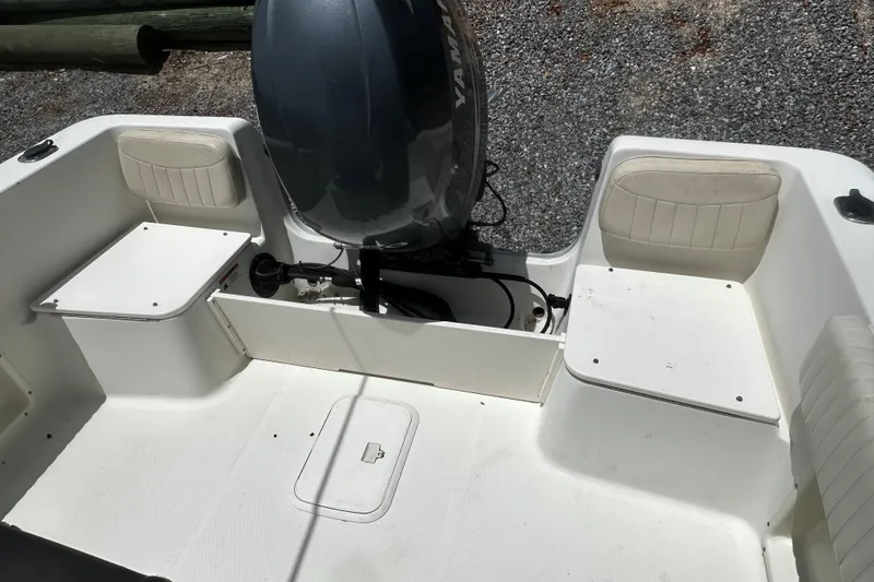 Slide: The Image of 2008 Hydra Sport 212 Lightning boat interior with Yamaha outboard motor, featuring seating and storage. - 10