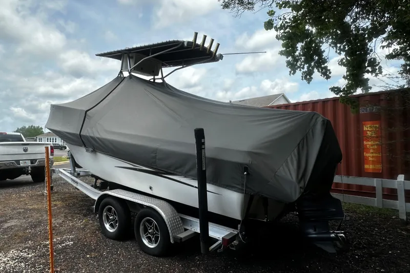 Slide: The Image of 2008 Hydra Sport 212 Lightning boat covered on trailer, parked outdoors. - 4