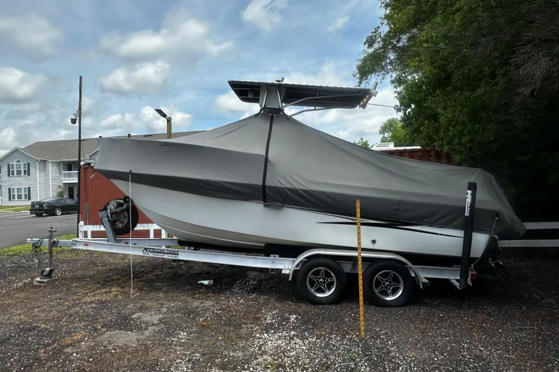Slide: The Image of 2008 Hydra Sport 212 Lightning boat covered on trailer, parked outdoors. - 5