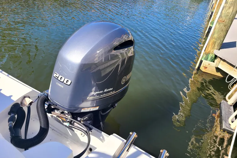 Slide: The Image of Yamaha 200 outboard motor on 2017 Sea Hunt Ultra 225 boat by the dock. - 15