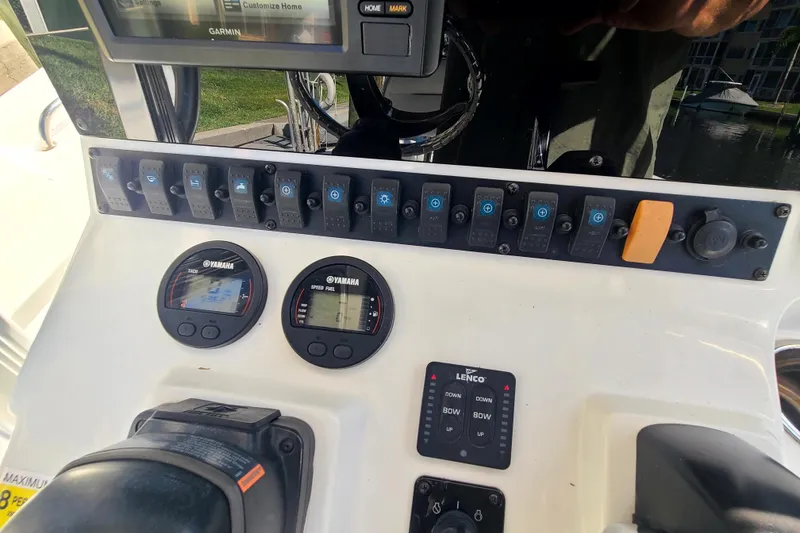Slide: The Image of Control panel of a 2017 Sea Hunt Ultra 225 boat with Yamaha gauges and Garmin display. - 7