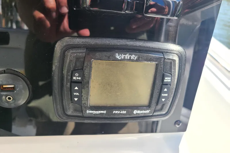 Slide: The Image of Infinity PRV-450 stereo system on 2017 Sea Hunt Ultra 225 boat dashboard. - 9