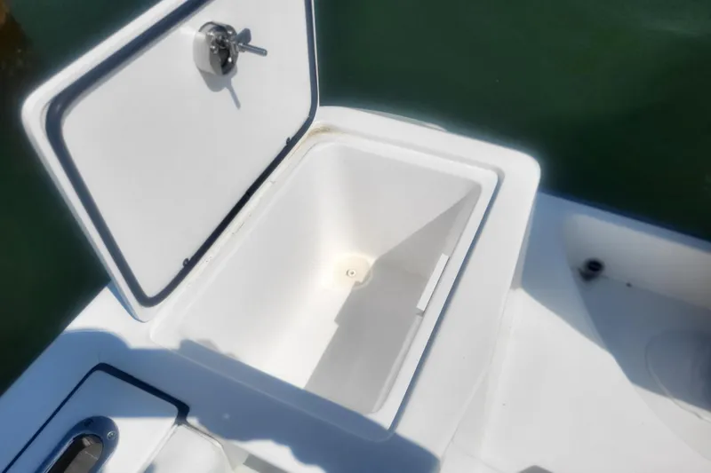 Slide: The Image of Open storage compartment on 2022 Edgewater 245CC boat, showcasing interior space. - 26