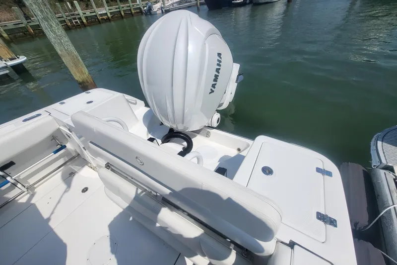 Slide: The Image of Edgewater 245CC 2022 boat with Yamaha outboard motor at dock. - 31