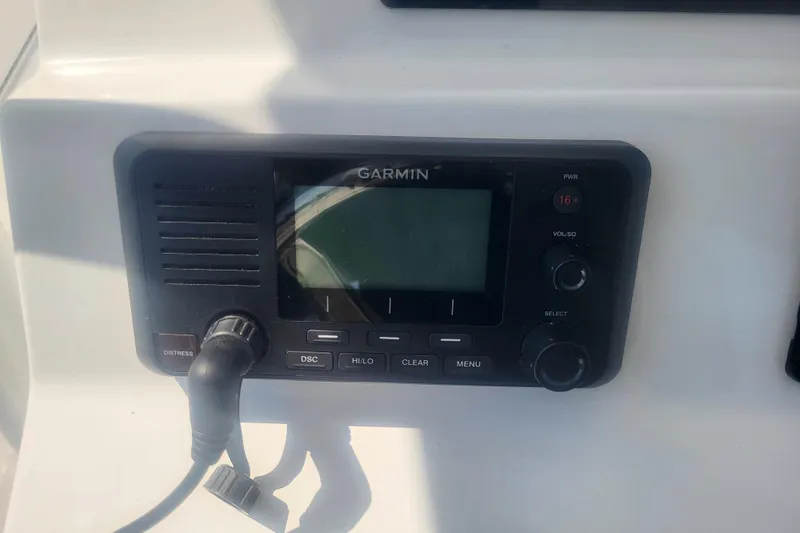 Slide: The Image of Garmin marine radio on 2022 Edgewater 245CC boat dashboard. - 50