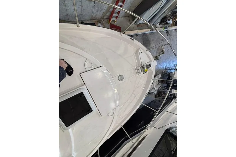 Slide: The Image of 2025 Ranger Tugs R-31 CB boat deck in a storage facility. - 11