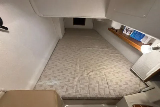 Slide: The Image of Cozy cabin interior of 2025 Ranger Tugs R-31 CB with a comfortable bed. - 23