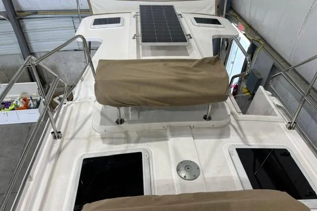 Slide: The Image of 2025 Ranger Tugs R-31 CB boat deck with solar panel and covered seating. - 5