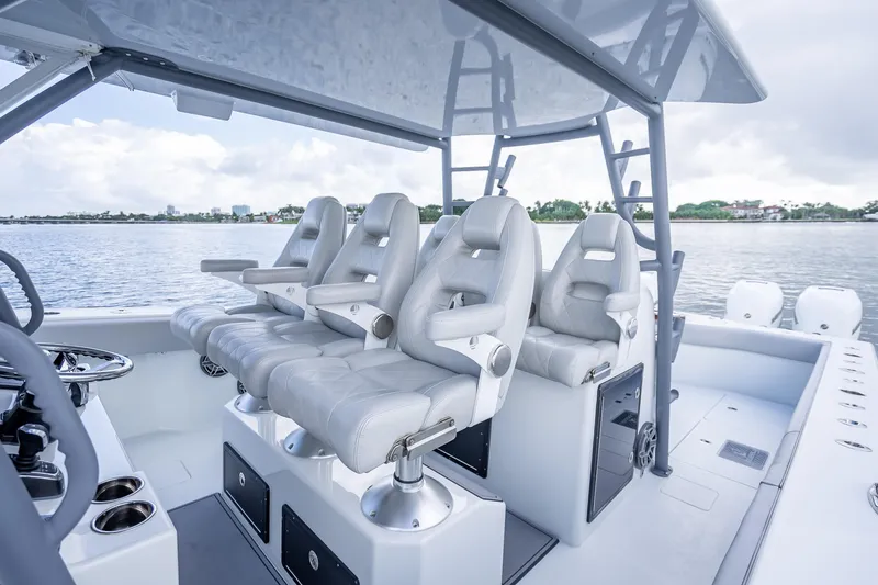 Slide: The Image of Luxurious seating on a 2020 Freeman 42LR boat, overlooking serene waters. - 10
