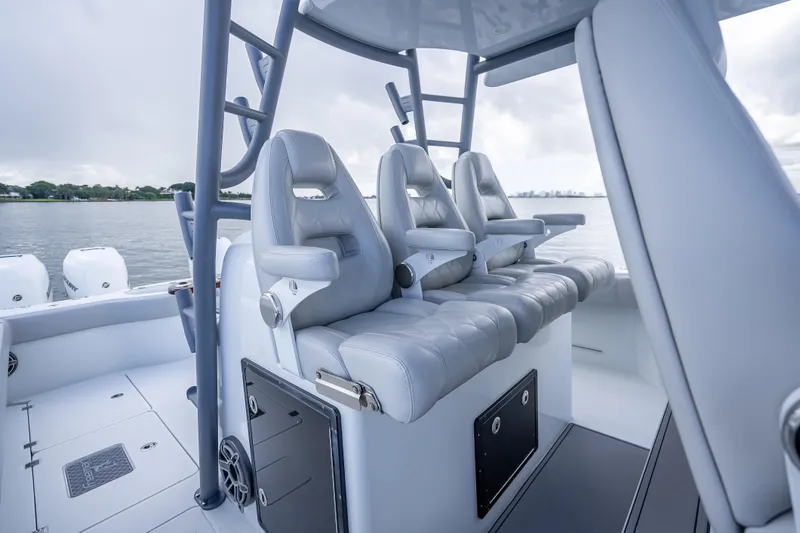 Slide: The Image of Luxurious seating on a 2020 Freeman 42LR boat, featuring sleek design and comfortable leather chairs. - 11