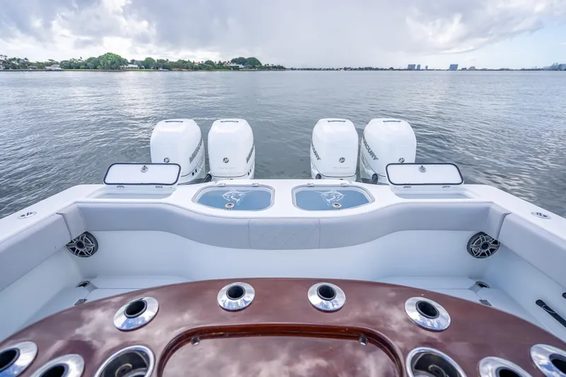 Slide: The Image of Freeman 42LR 2020 boat with four powerful outboard engines on a calm lake. - 17