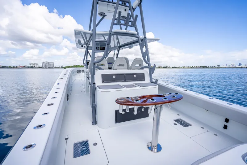 Slide: The Image of 2020 Freeman 42LR boat on calm water, featuring sleek design and modern amenities. - 24