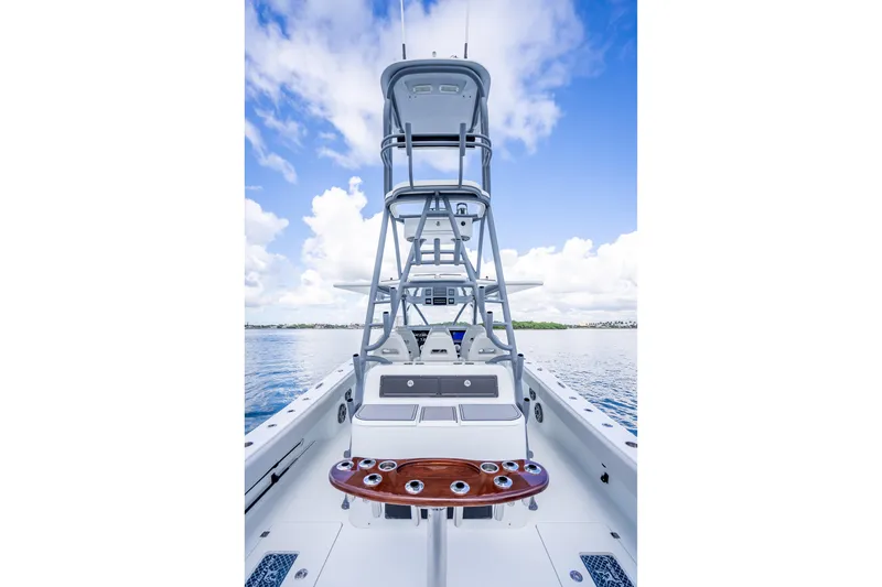 Slide: The Image of Freeman 42LR 2020 boat with tower, rod holders, and clear sky background. - 27