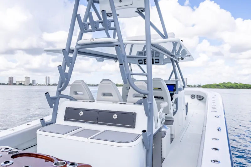 Slide: The Image of 2020 Freeman 42LR boat interior with modern seating and controls on a calm water backdrop. - 28