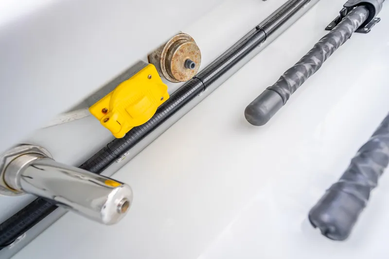Slide: The Image of Close-up of Freeman 42LR 2020 boat components, featuring yellow connector and wrapped cables. - 30