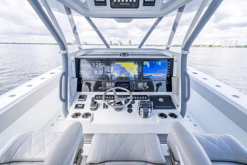 Slide: The Image of Modern helm of 2020 Freeman 42LR boat with advanced navigation displays and controls. - 31