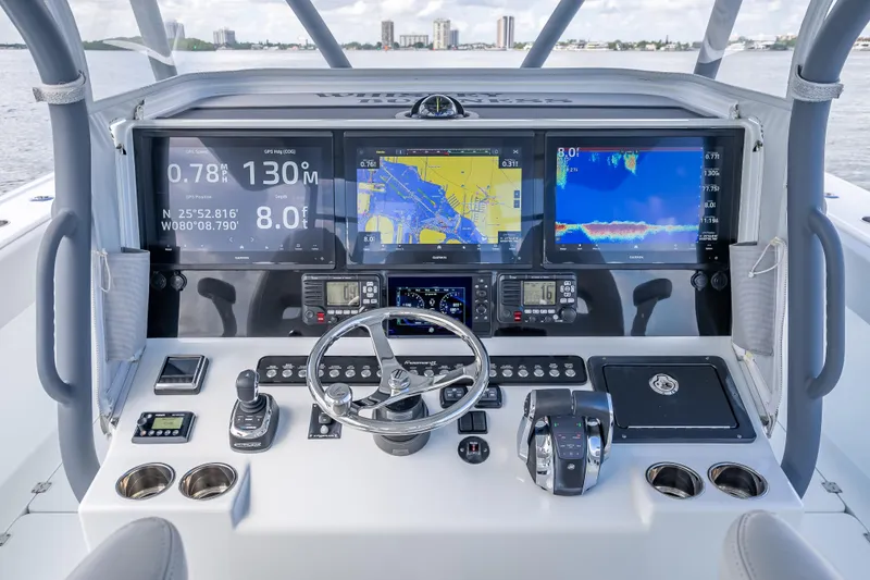 Slide: The Image of Control panel of a 2020 Freeman 42LR boat with advanced navigation displays. - 32