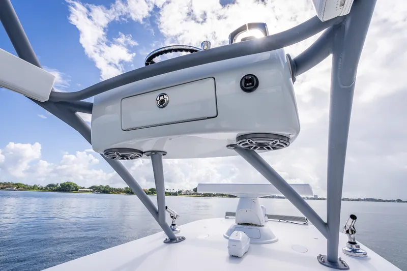 Slide: The Image of Freeman 42LR 2020 boat helm station with speakers, under a clear blue sky. - 33