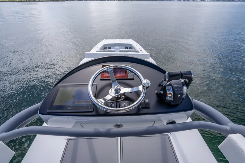 Slide: The Image of Helm of 2020 Freeman 42LR boat with steering wheel and navigation controls. - 34