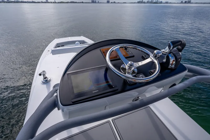 Slide: The Image of Helm of 2020 Freeman 42LR boat with steering wheel and navigation display. - 36