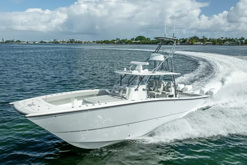 Slide: The Image of 2020 Freeman 42LR boat cruising on open water under a cloudy sky. - 5