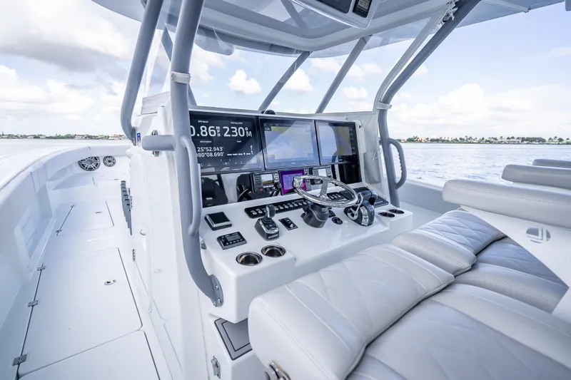 Slide: The Image of Modern Freeman 42LR boat cockpit with advanced navigation systems, 2020 model, on open water. - 8