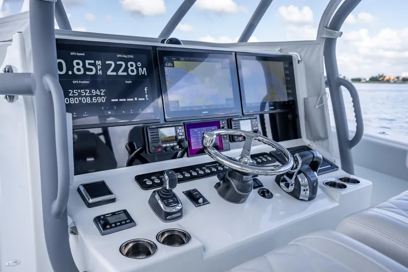 Slide: The Image of Freeman 42LR 2020 boat dashboard with advanced navigation displays and controls. - 9